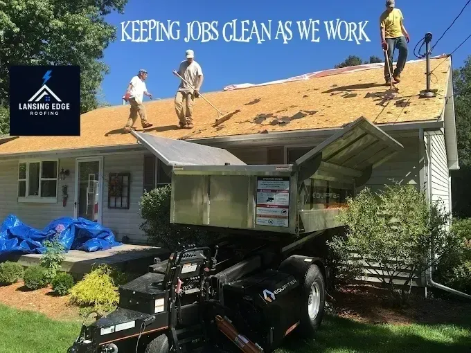 Workers on a roof replacing shingles, with a dumpster truck below and banner text reading “Keeping Jobs Clean As We Work.”
