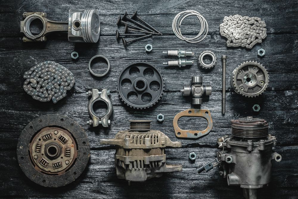 A Bunch of Parts Are Laying on a Wooden Table — Coffs Harbour Bearing Centre in Coffs Harbour, NSW