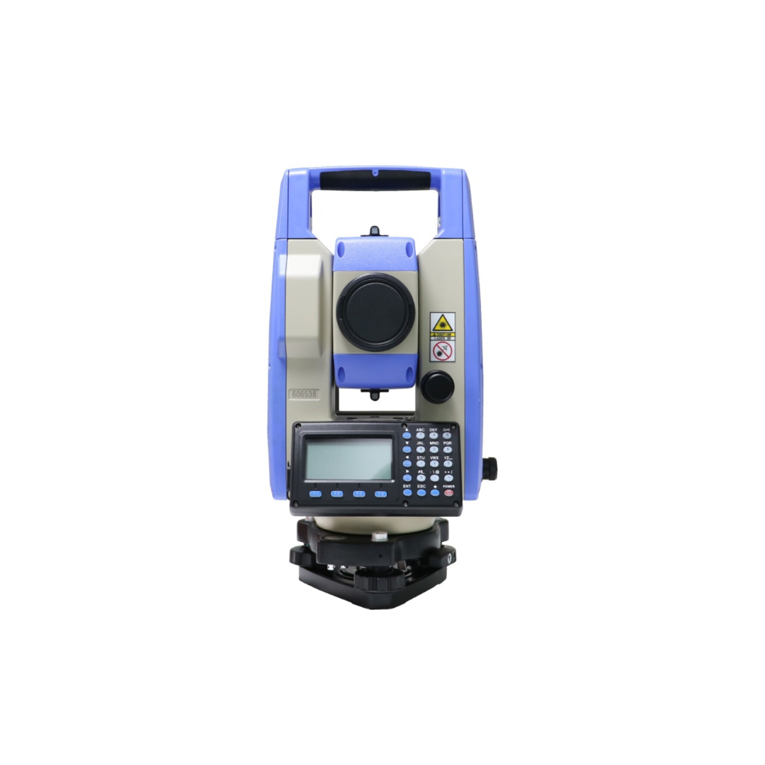 Blue total station surveying instrument with digital display and keypad, isolated on white background