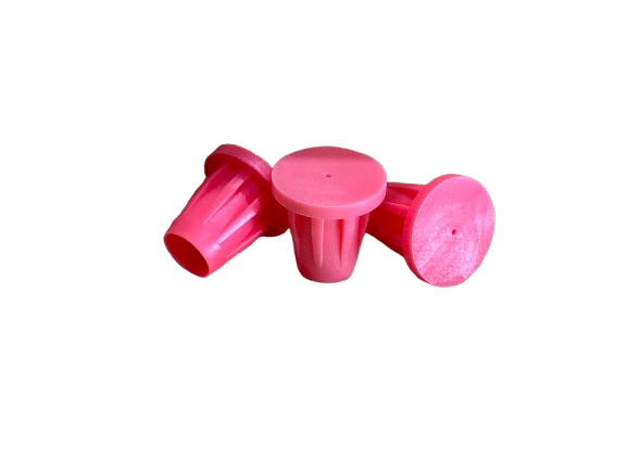 Three pink cupcake baking molds arranged on a white background