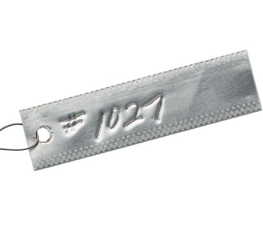Silver metal tag engraved “10-21” with a hole and attached ring