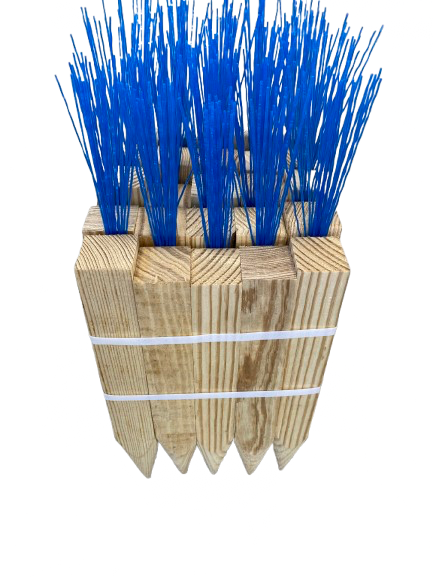 Blue plastic brush bristles in a stacked wooden block with white bands