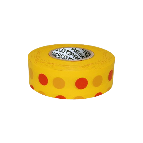 Yellow roll of red-dotted adhesive labels on white background