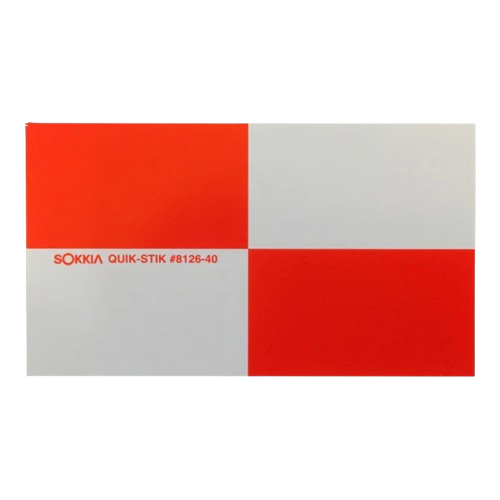 Red-and-white checkerboard calibration target with small red text on the left center