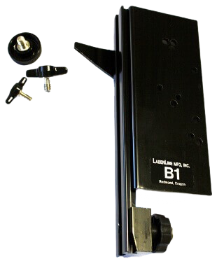 Black wall-mounted lock/door hardware with a key and small parts on a white background