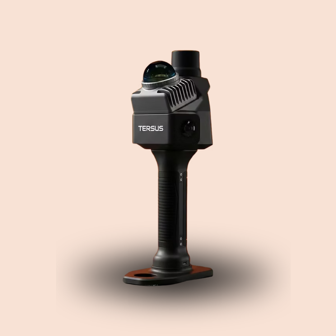 Black handheld device with a knob and orange base on a beige background
