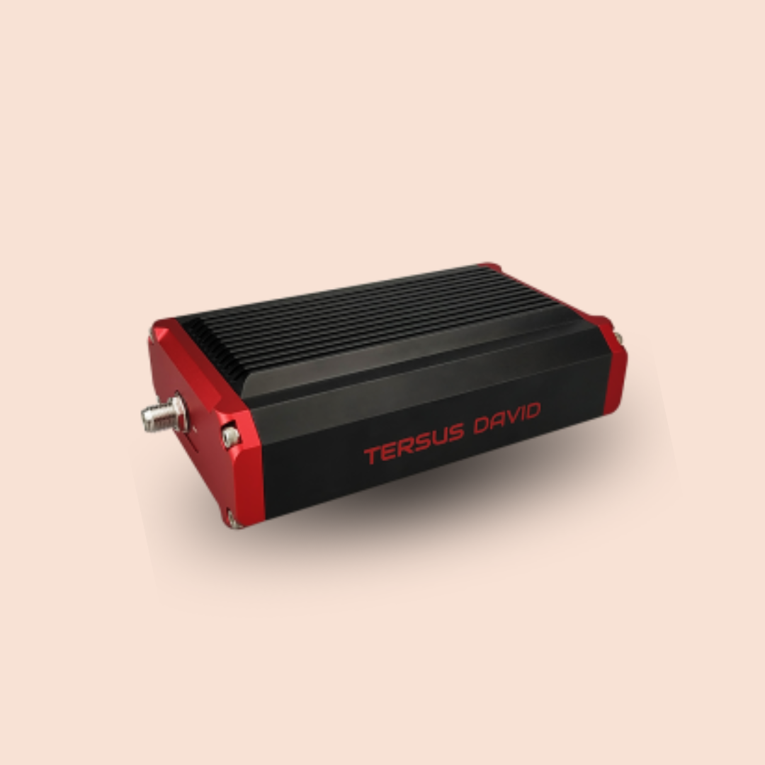 Black-and-red compact electronic device with a ribbed top and connector port on one end