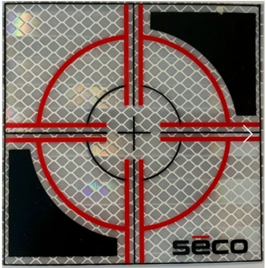 Red crosshair target with black corner squares on a gray patterned SECO background.