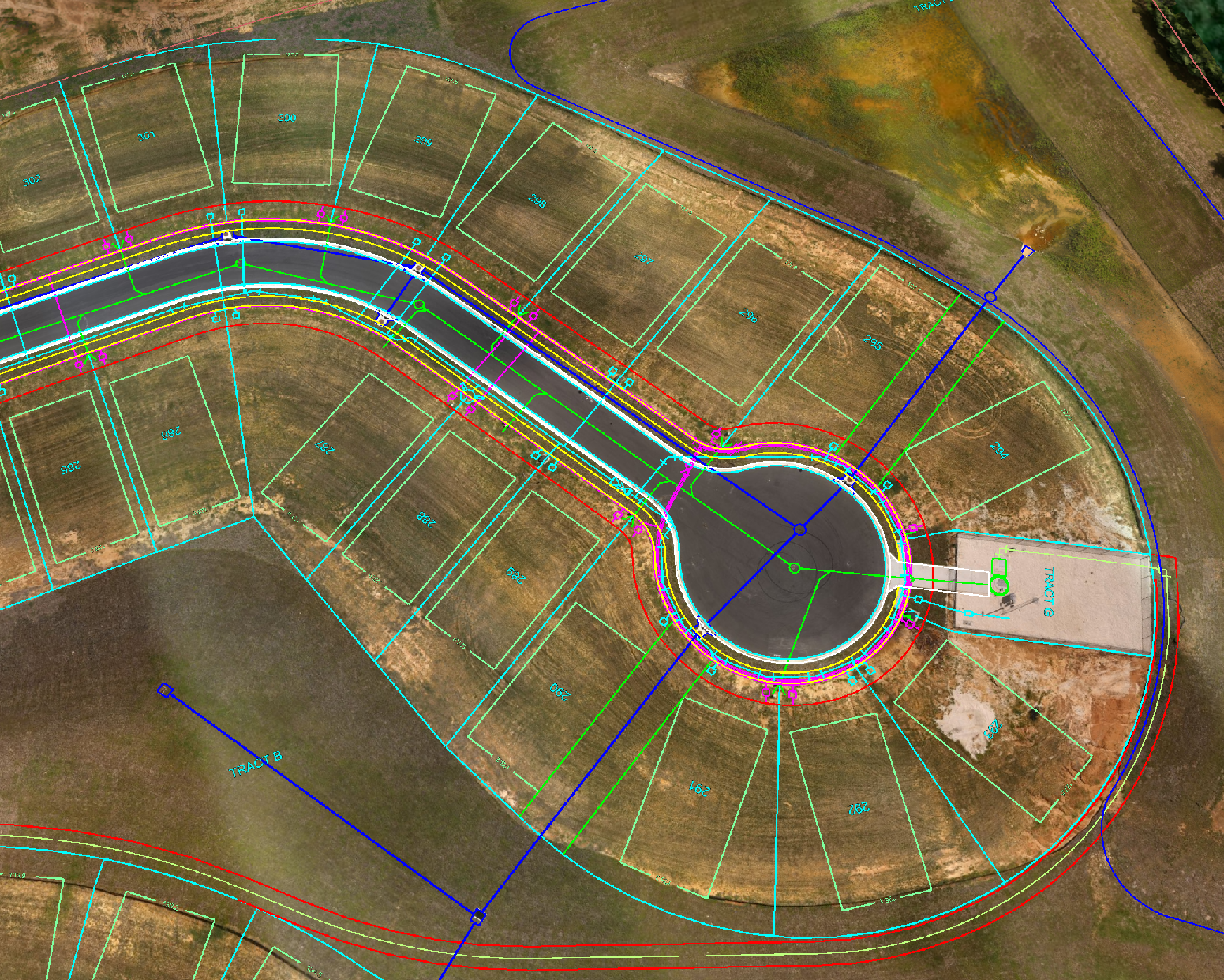 Colored map of a circular subdivision layout with roads, lots, and a central roundabout