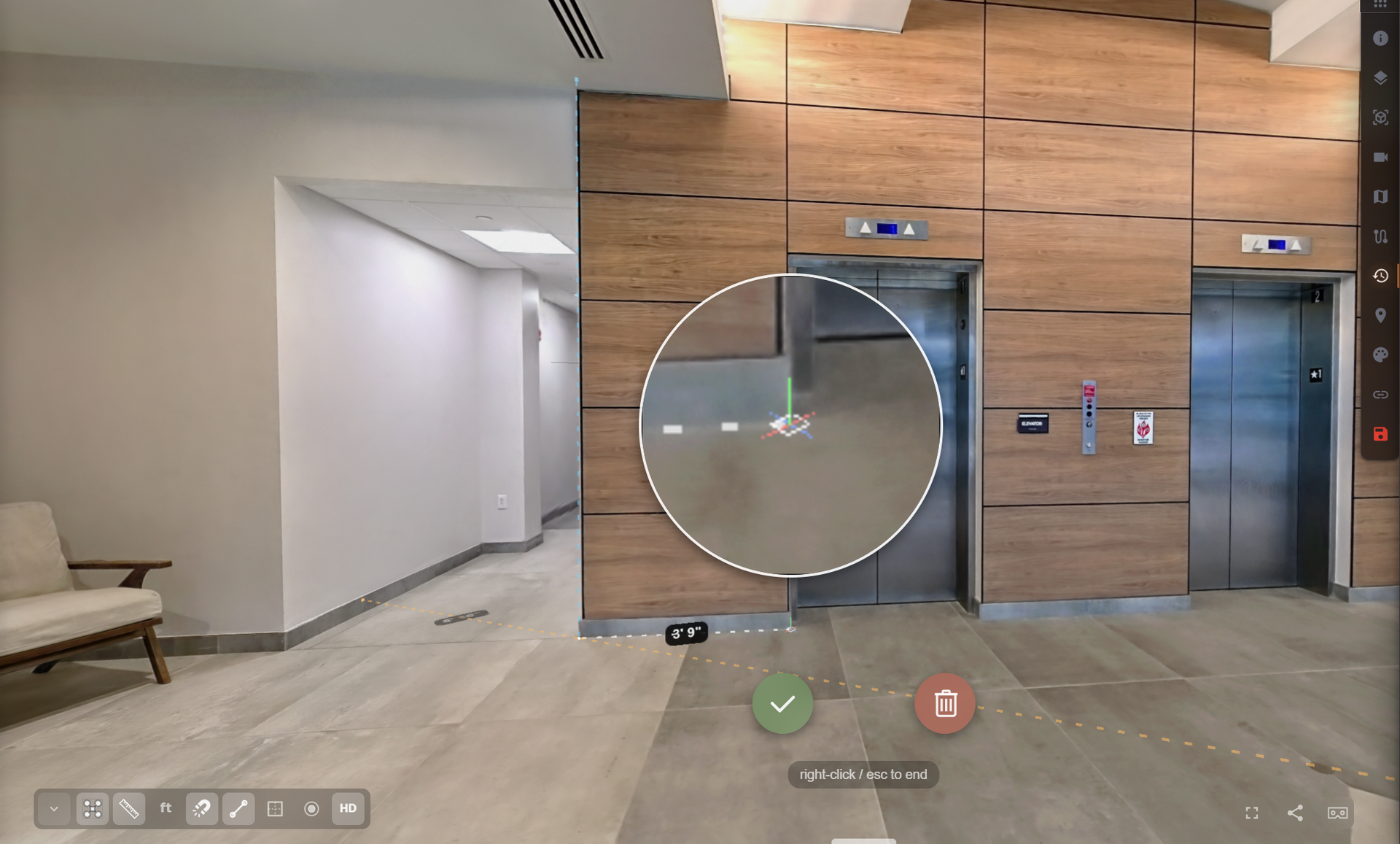 Modern lobby with wood-paneled wall, elevator, bench, and circular mirror on a tiled floor.