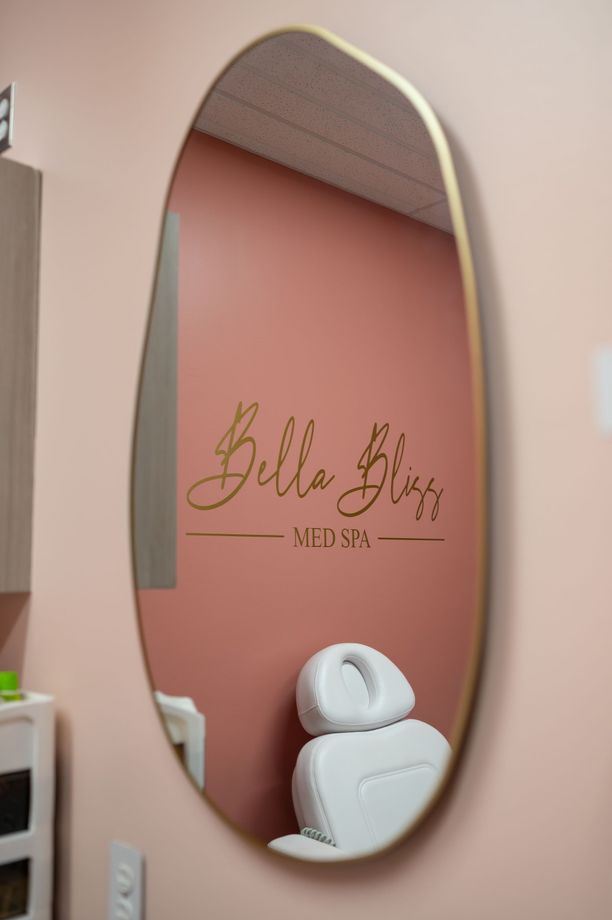 A sign that says bella bliss med spa on it