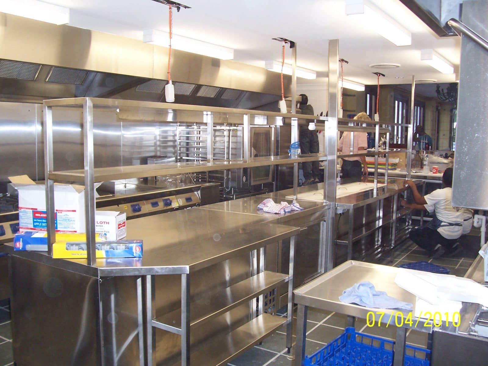 Stainless Steel Commercial Kitchen With Shelving and Appliances — Highlander Metals in Newcastle, NSW
