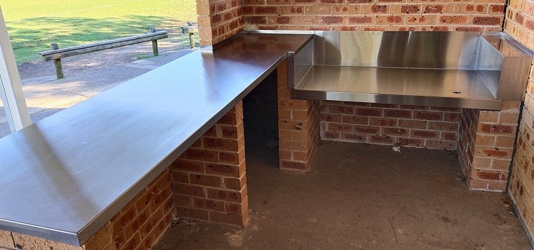 Outdoor Brick Barbecue With Stainless Steel Countertops — Highlander Metals in Kirrawee, NSW