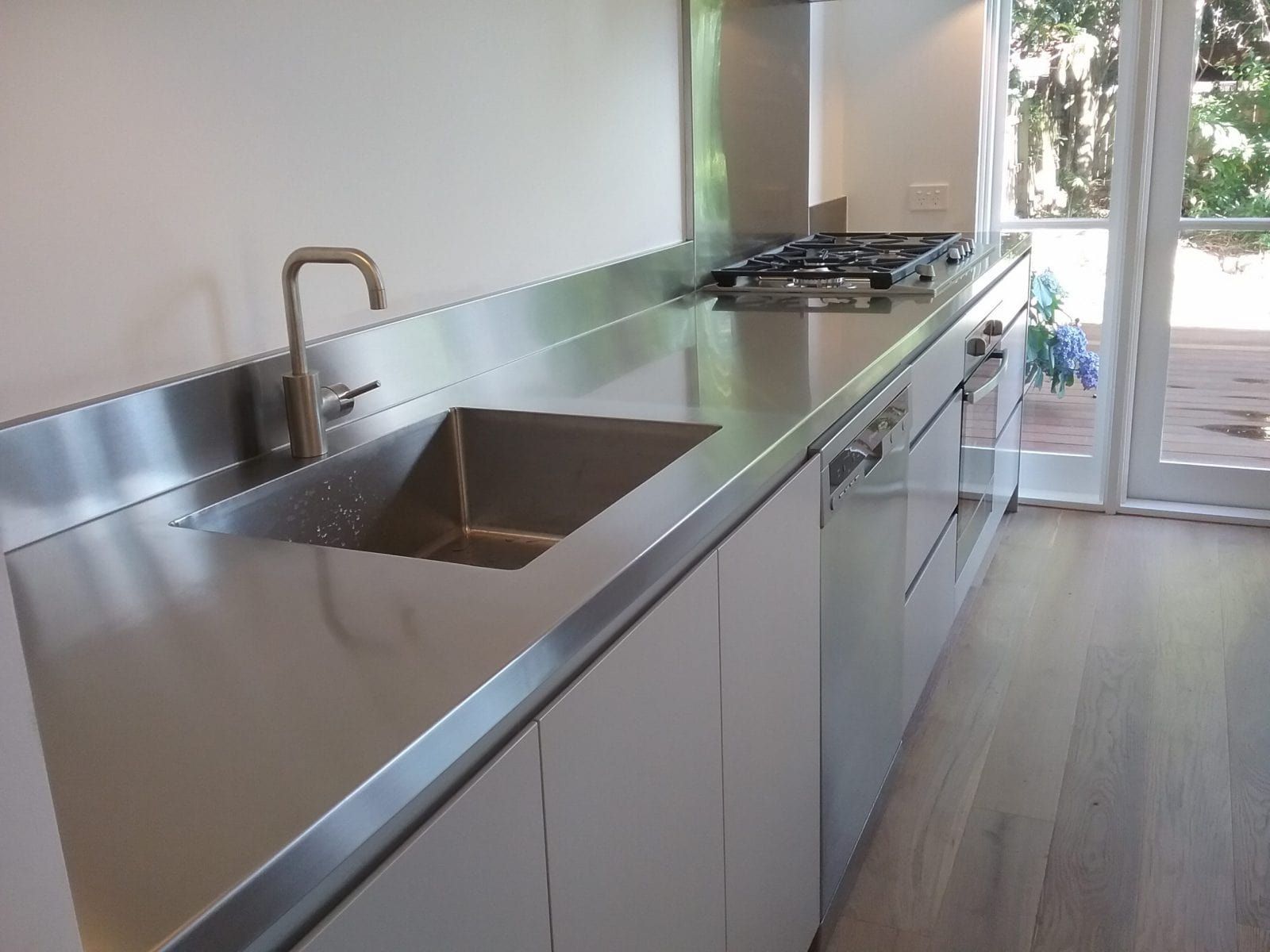 Stainless Steel Kitchen Countertop With Sink and Stove — Highlander Metals in Newcastle, NSW