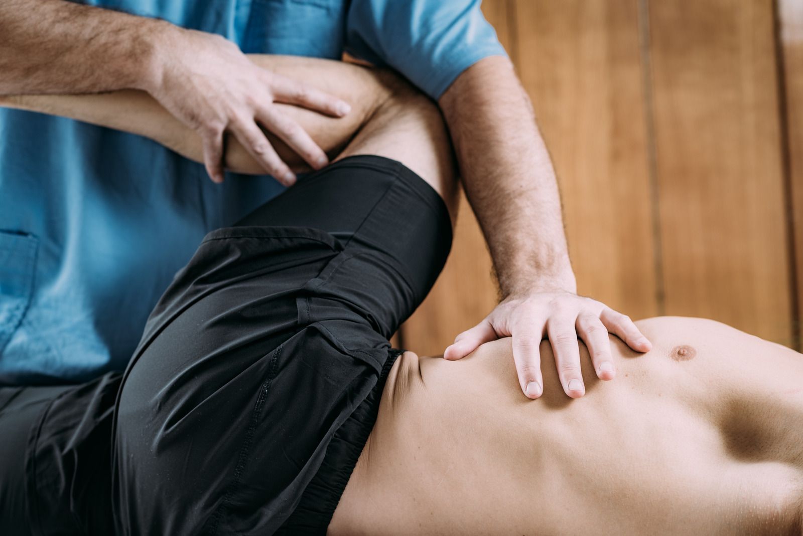 A therapist working along a client's shoulder.