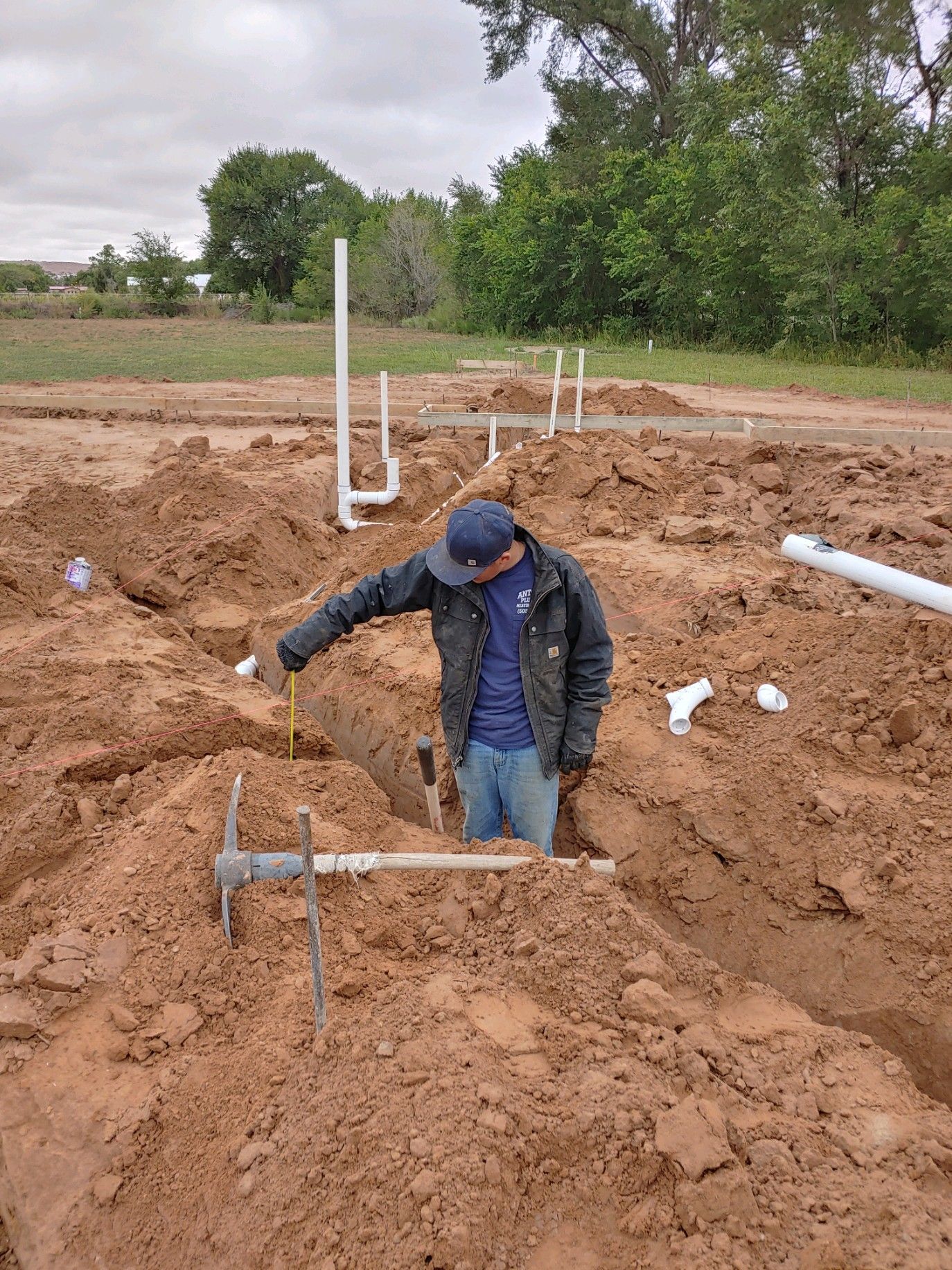 Man Measuring Height — Belen, NM — Antonio's Plumbing Heating & Cooling 