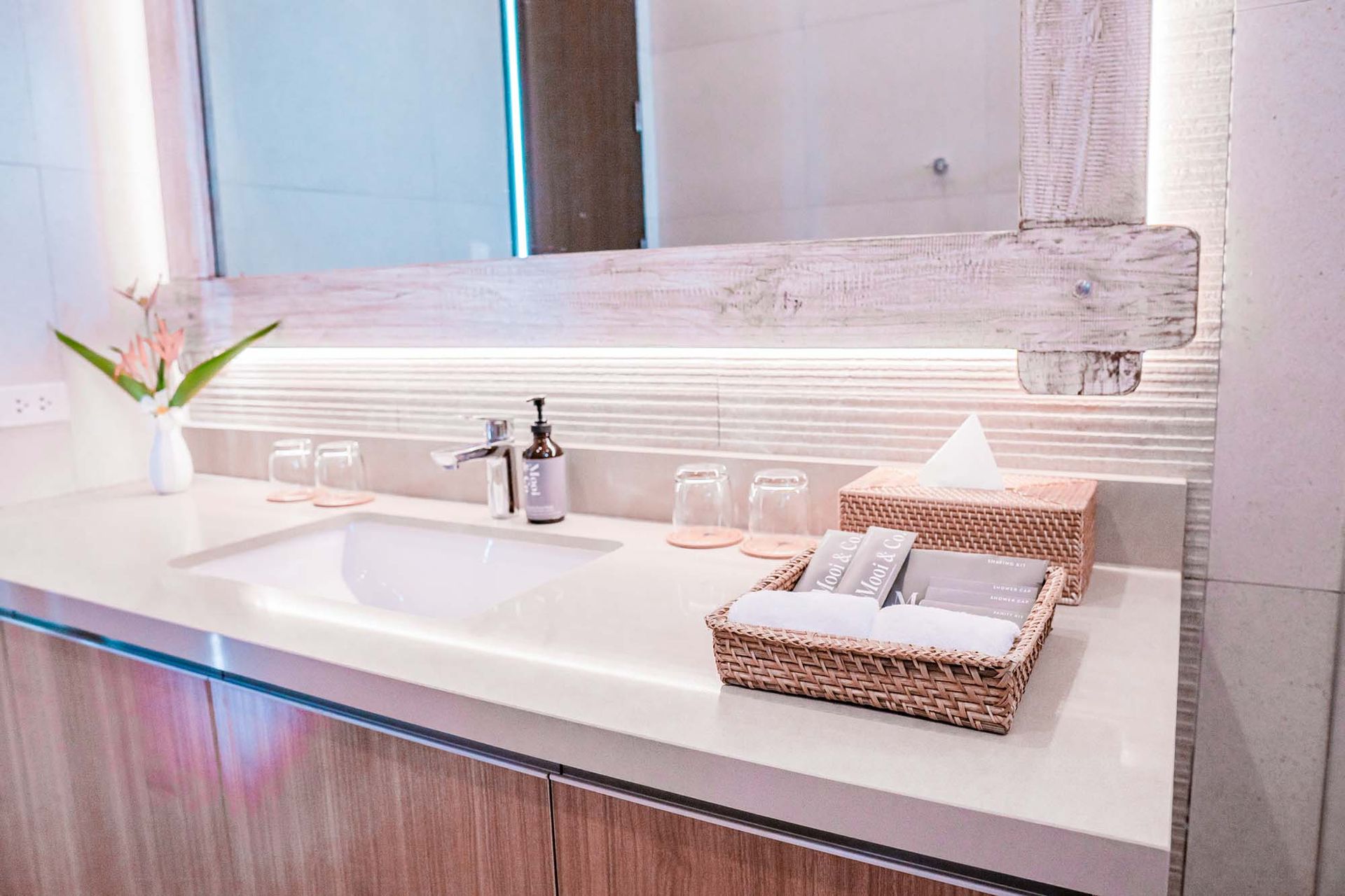 Luxury bathroom sink with woven basket featuring elegant marble countertop
