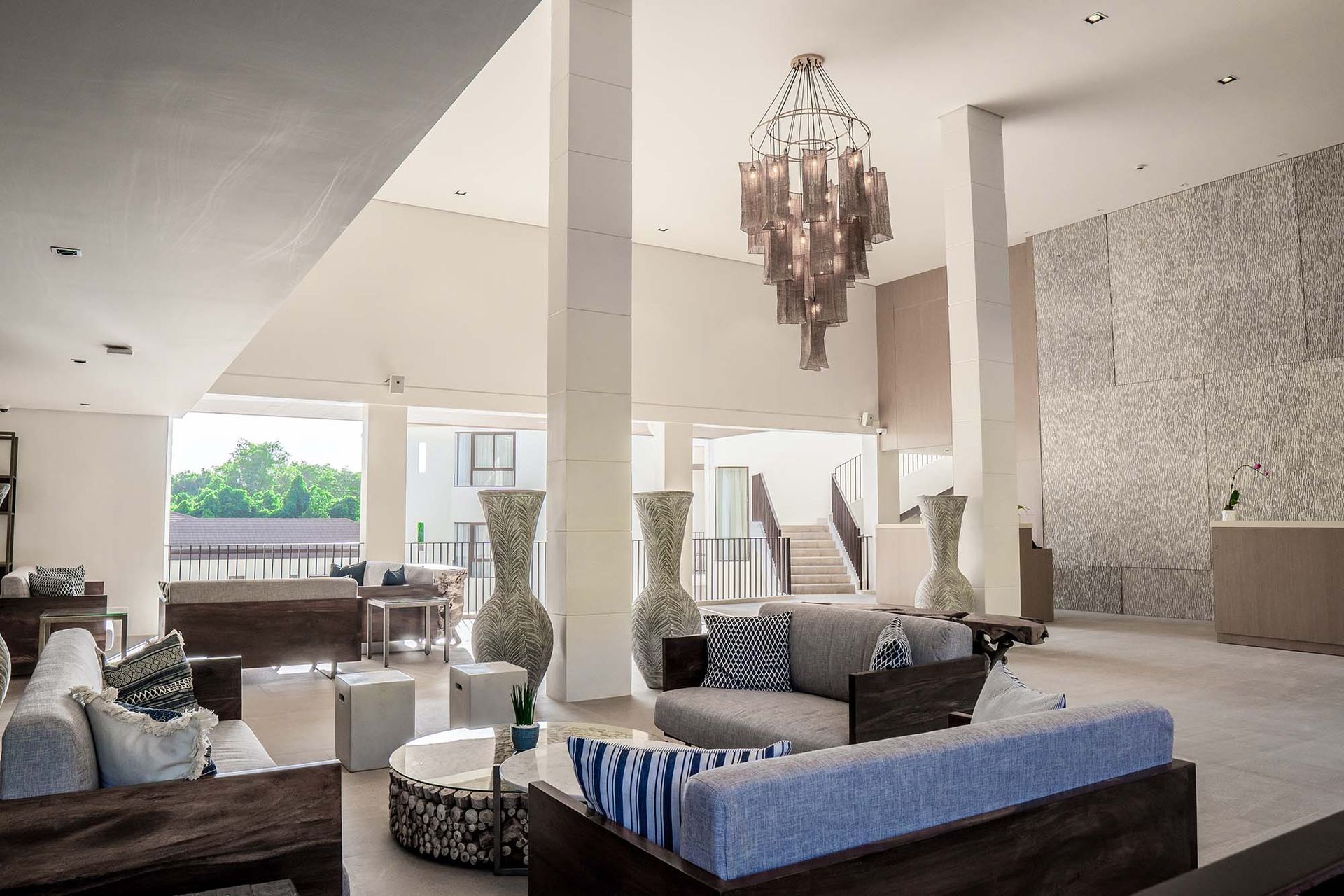 Charlie's El Nido hotel lobby with chandelier and stylish lounge seating