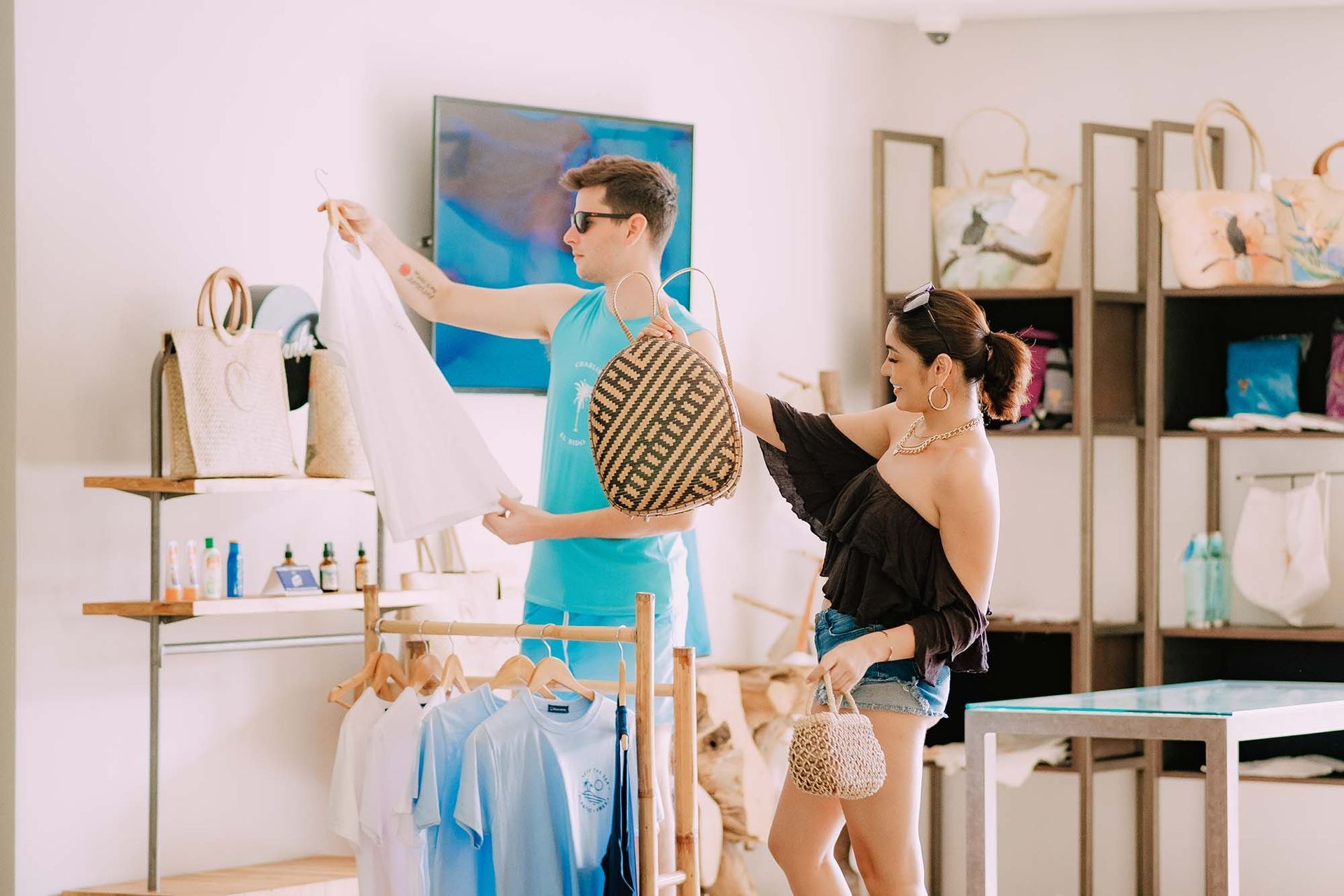 Couple shopping for bags and apparel at Charlie's El Nido gift shop