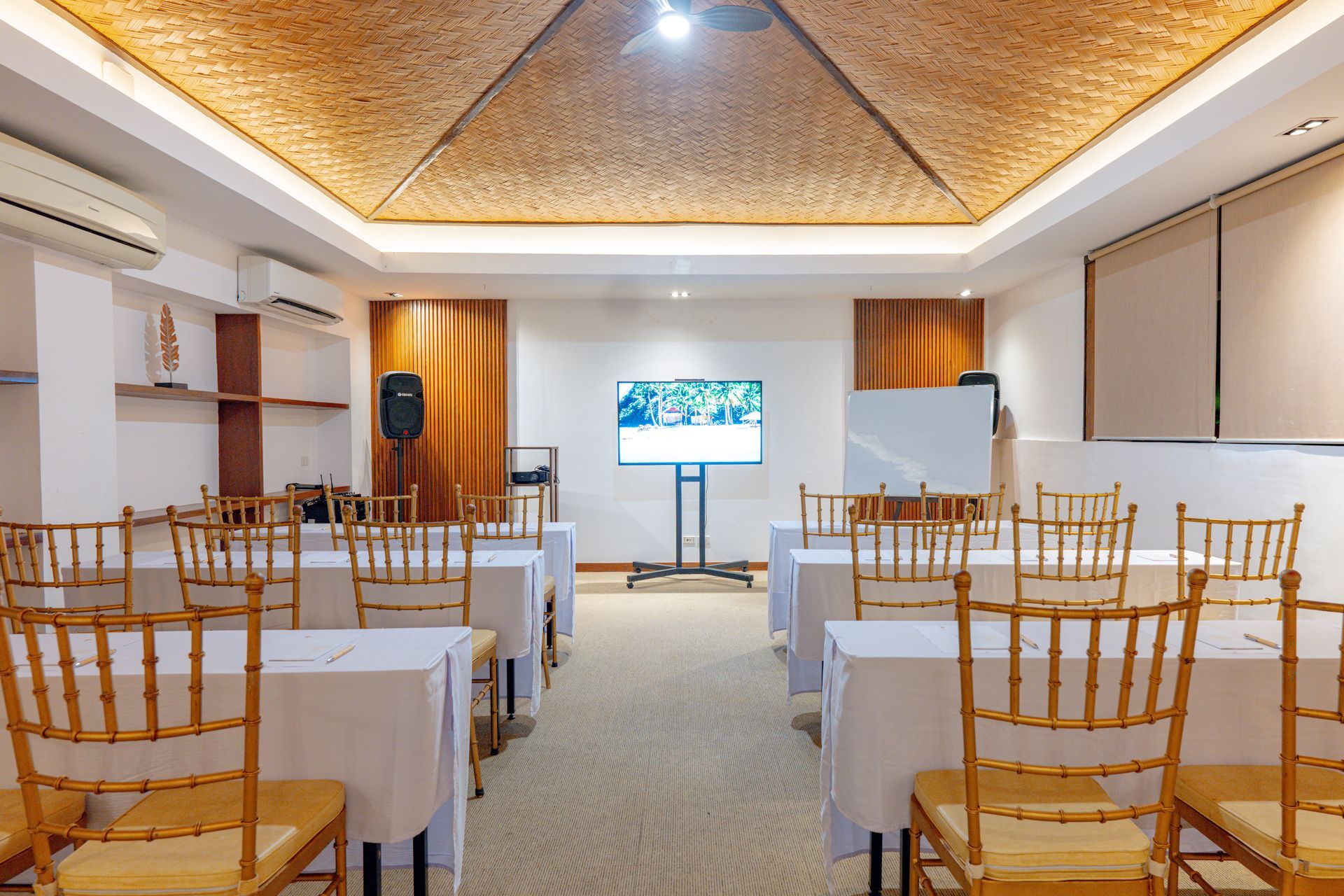 Formal outdoor dining table setup among tropical greenery at Charlie's El Nido