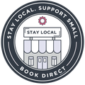 A sticker that says stay local support small book direct