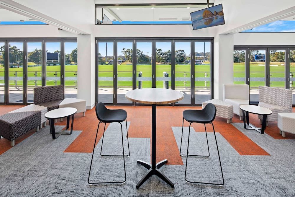 There Is a Table and Chairs in The Middle of The Room — Nambucca Plumbing in Urunga, NSW