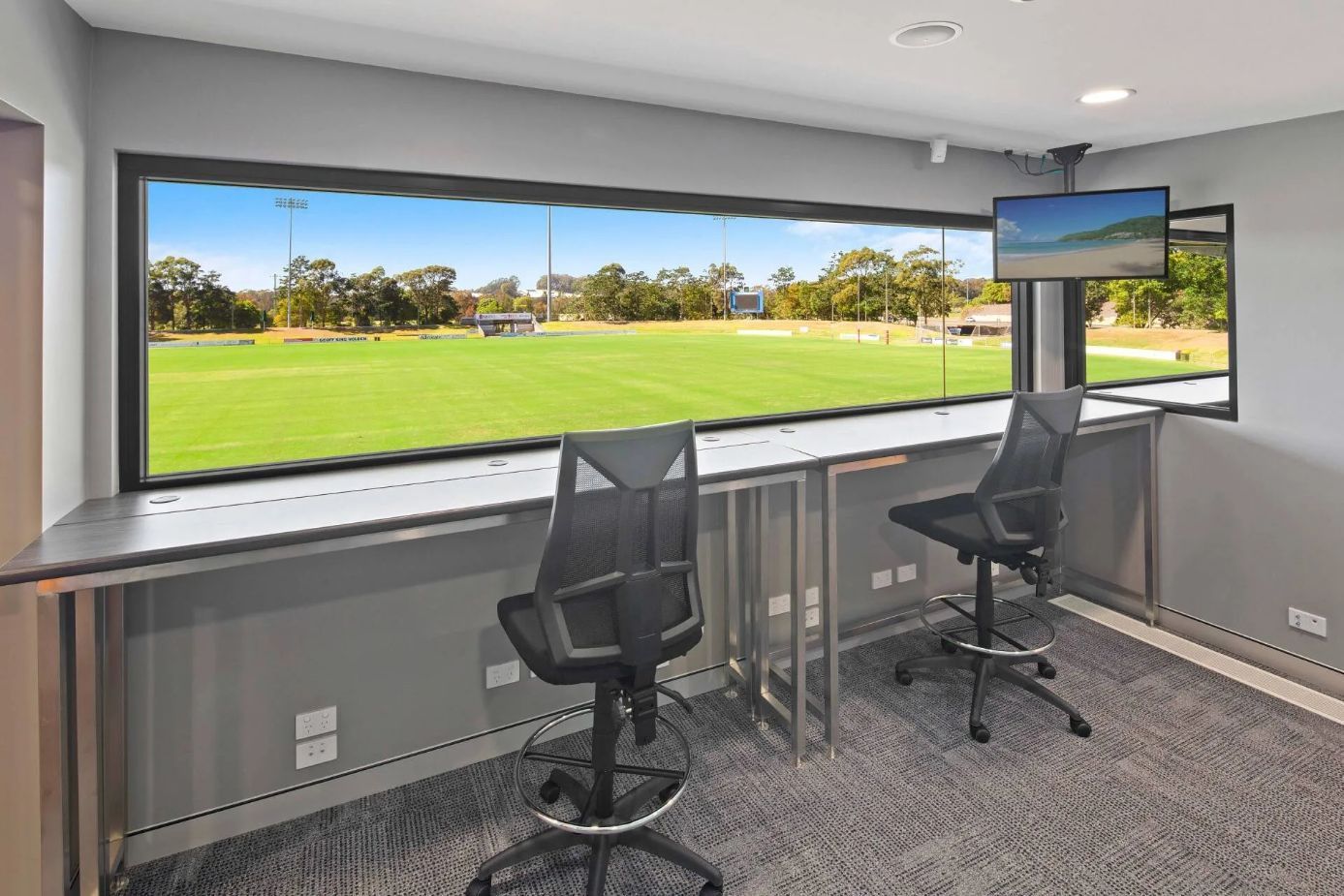A Room with Two Chairs and A Large Window with A View of A Field — Nambucca Plumbing in Nambucca Heads, NSW