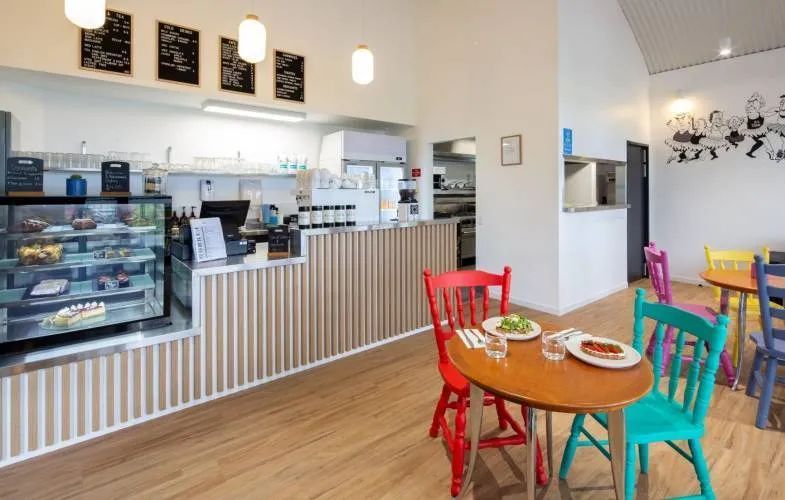 A Restaurant with Tables and Chairs and A Counter — Nambucca Plumbing in Nambucca Heads, NSW