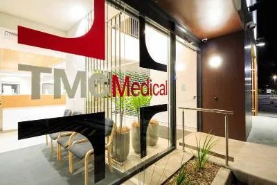A Waiting Room with Chairs and A Sign on The Window that Says Tm Medical — Nambucca Plumbing in Nambucca Heads, NSW