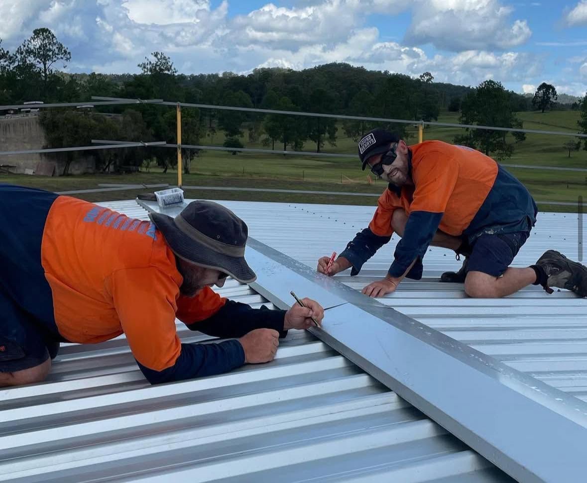 Two Men Working on Roof