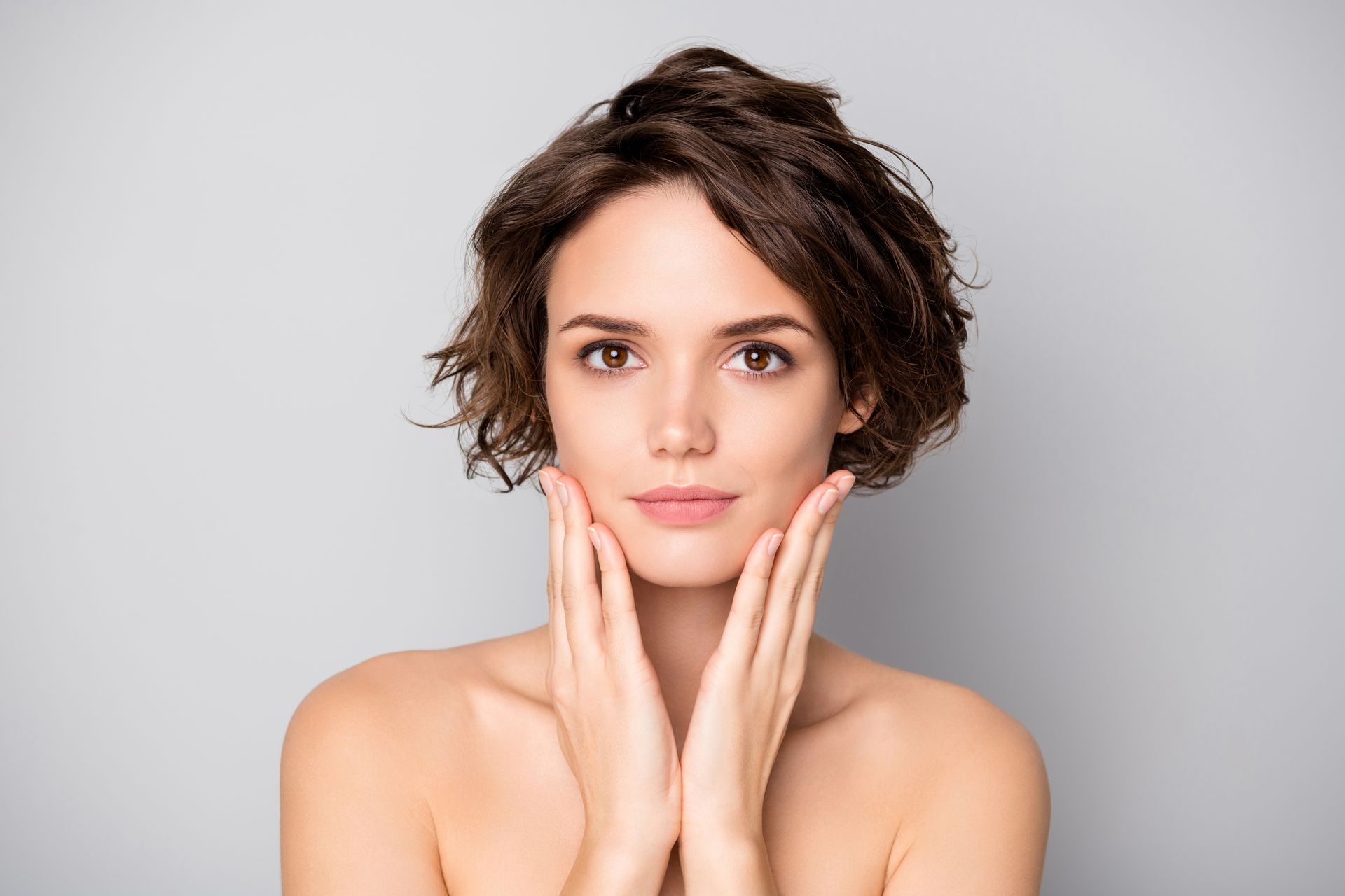 woman touching cheeks beauty