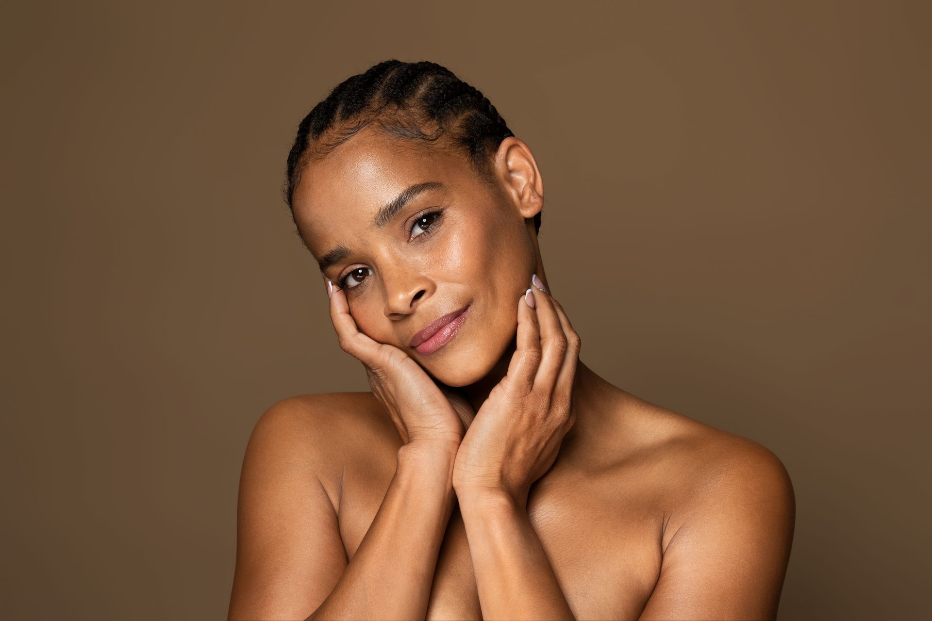 woman touching her face