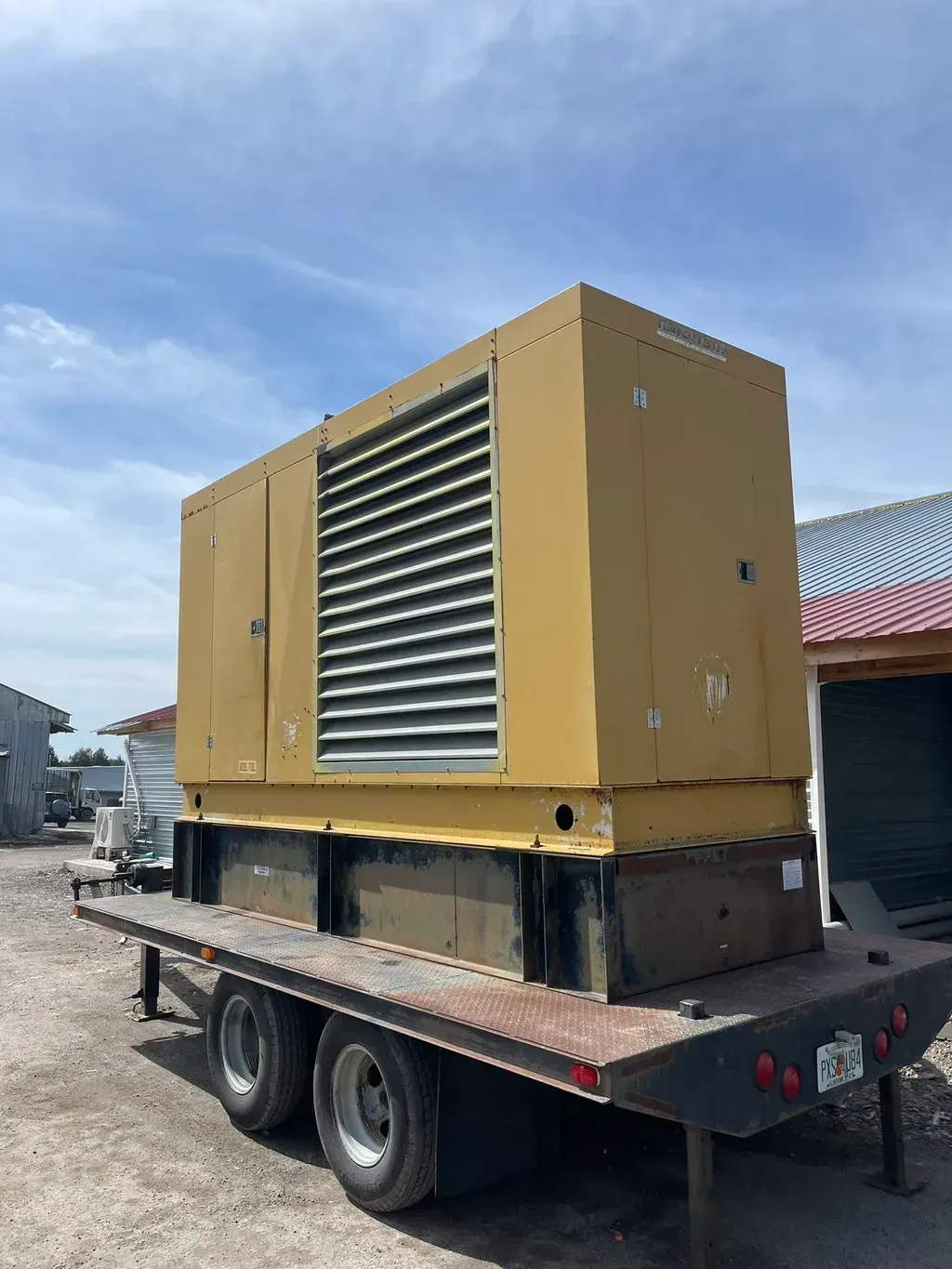 American Electric LLC | A large yellow box is sitting on top of a trailer.