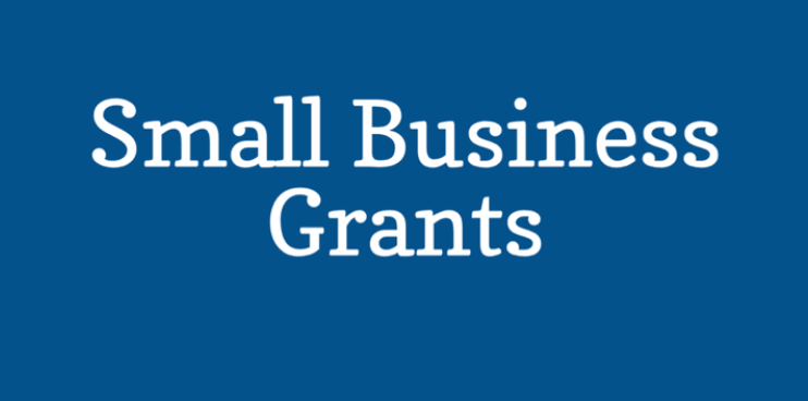 A blue background with white text that says small business grants