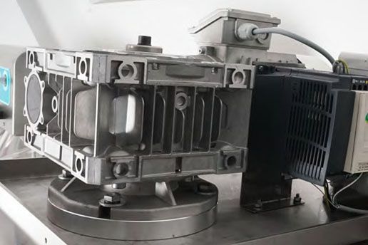 A close up of a machine with a motor attached to it.