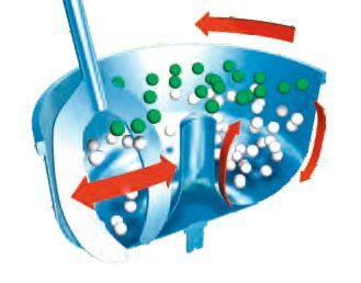 A blue bowl filled with green and white balls and a spoon in it.