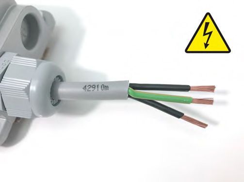 A close up of a cable with a warning sign next to it.