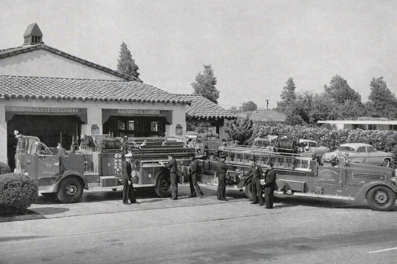 Los Alamitos, CA funeral home and cremations vintage fire station scene with firefighters and engines.