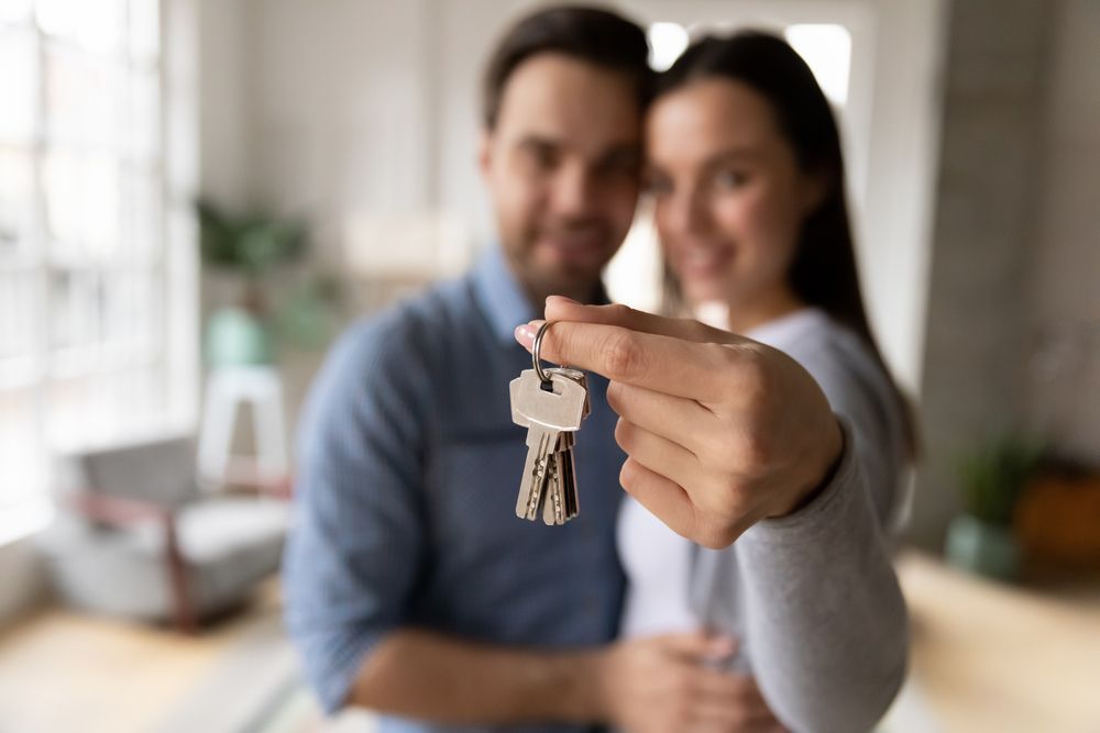 couple holding house keys