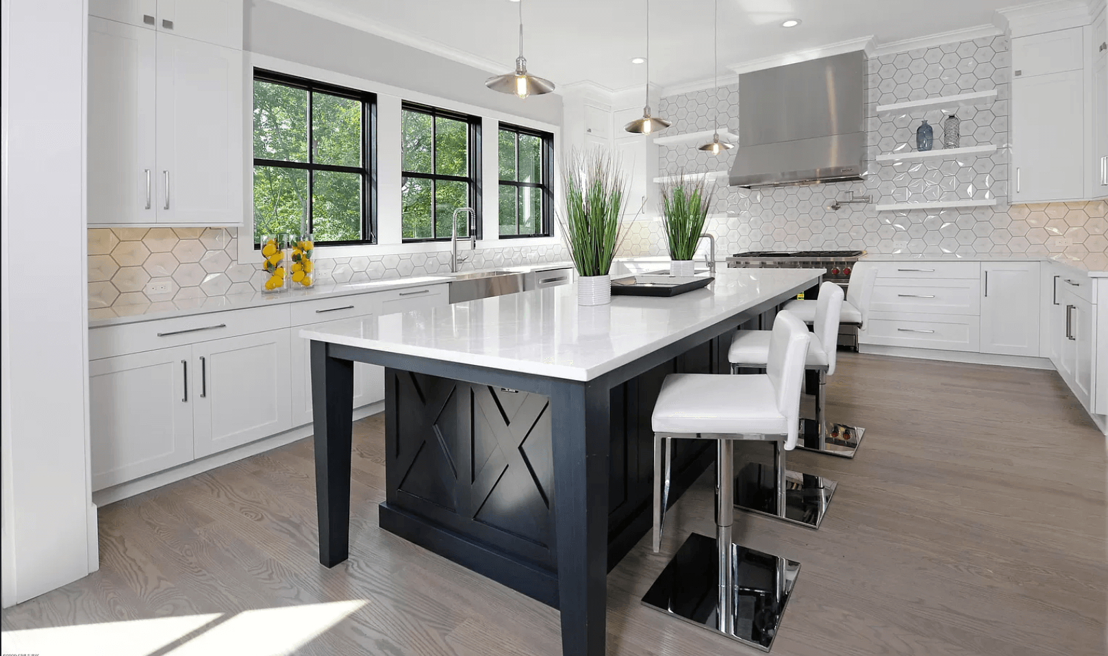 There is a large island in the middle of the kitchen.
