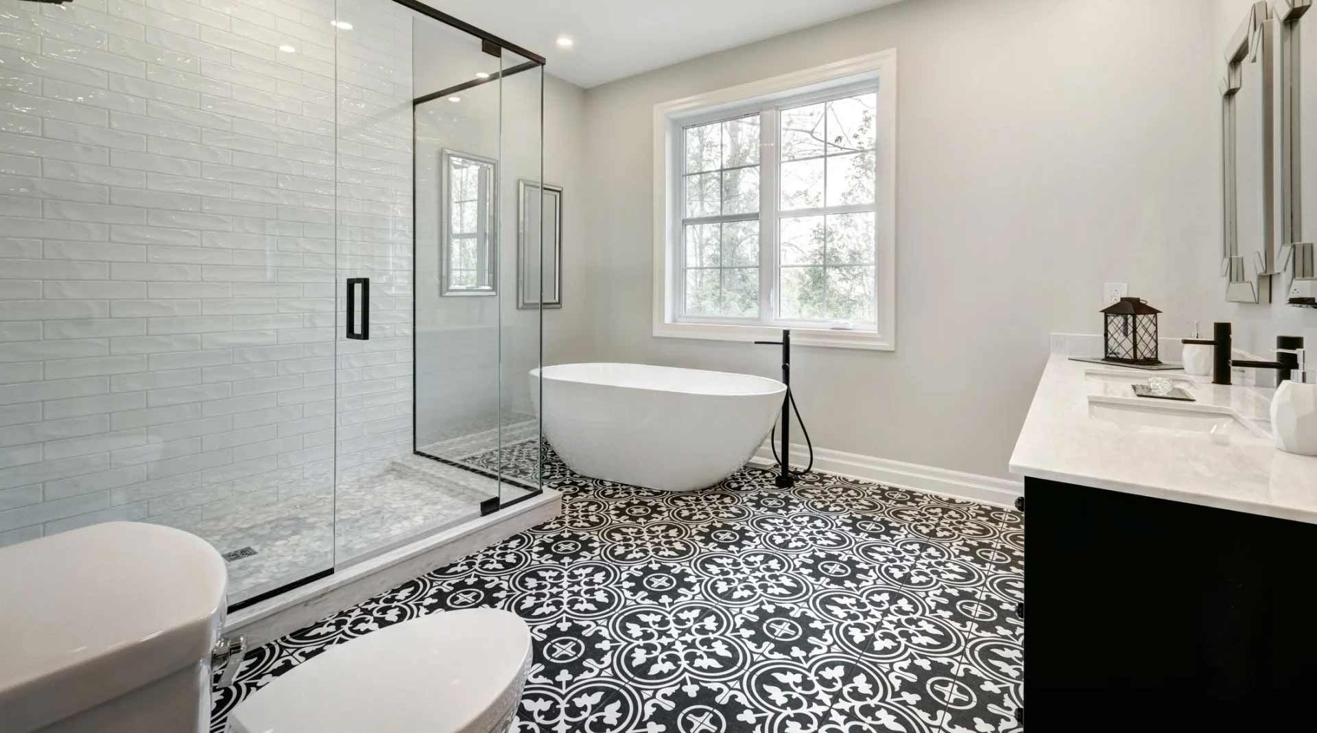 A bathroom with a tub , toilet , sink and shower.