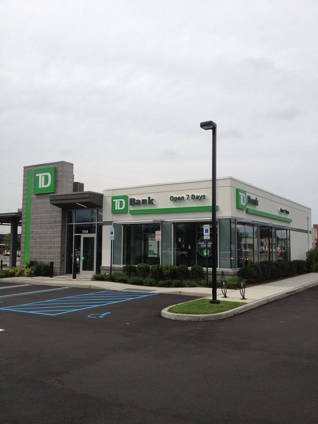 A td bank building with a parking lot in front of it