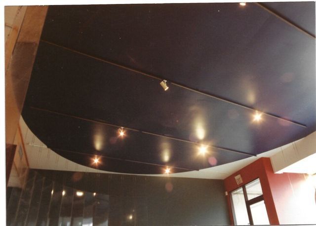 A picture of a ceiling with lights on it