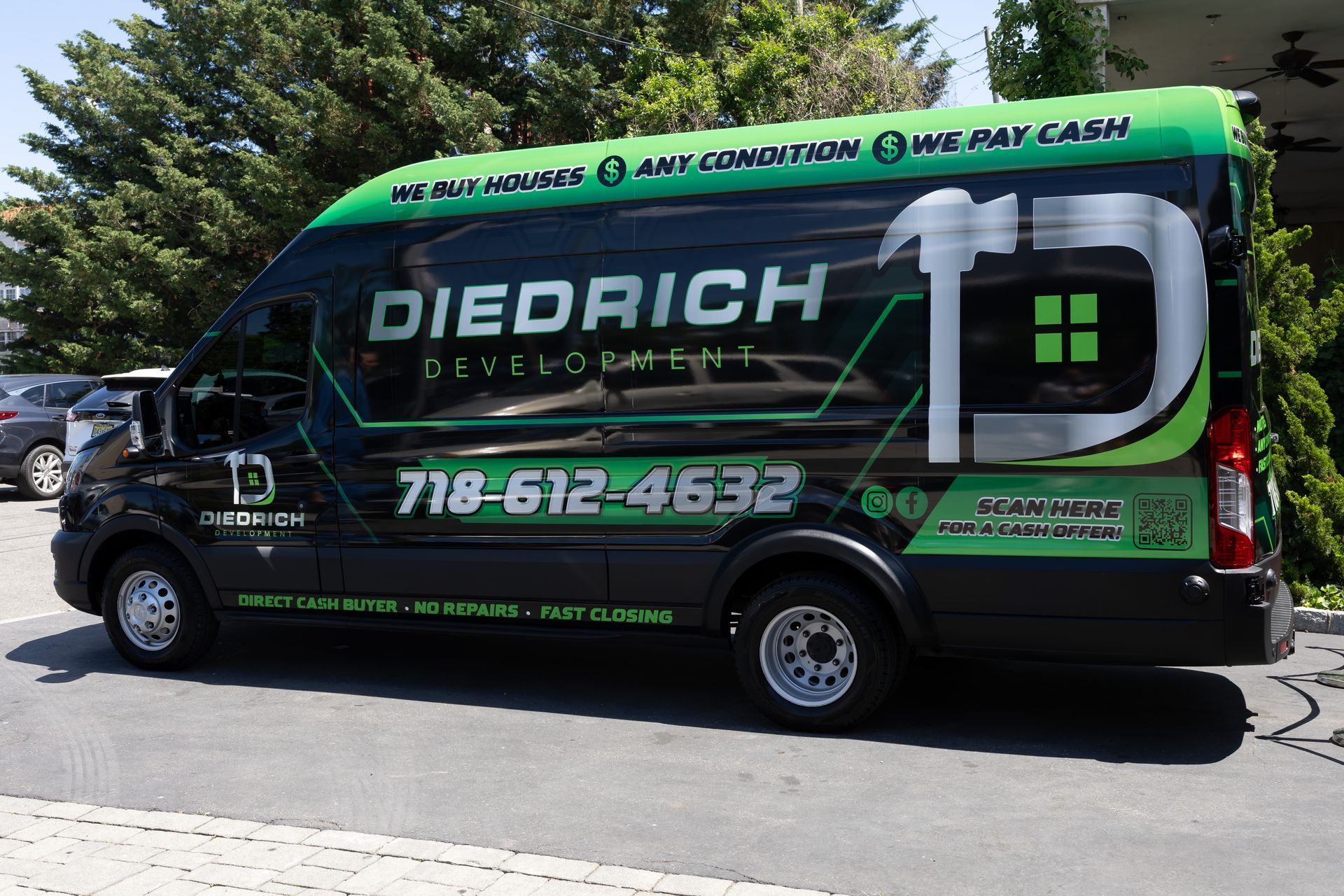 Green Diedrich Plumbing & Heating service van parked outdoors, with large white logo and phone number on the side