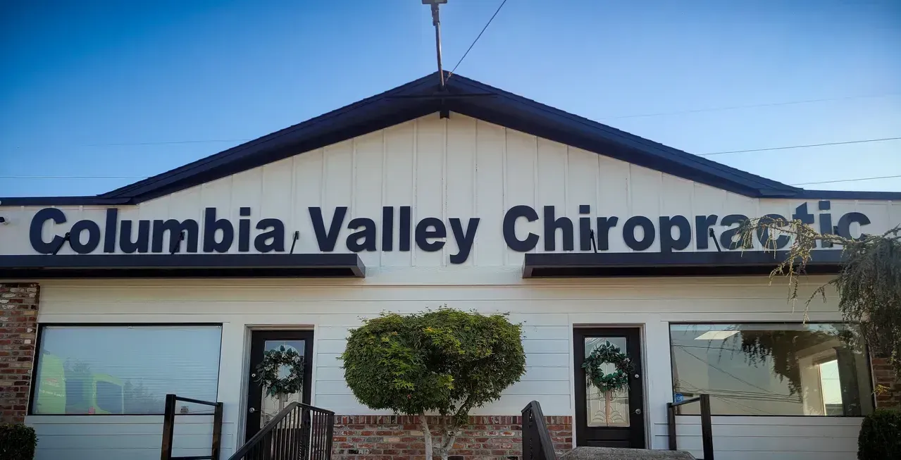 Columbia Valley Chiropractic storefront with white facade, dark roof, and front windows