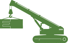 Green mobile crane lifting a rectangular object with the letter 