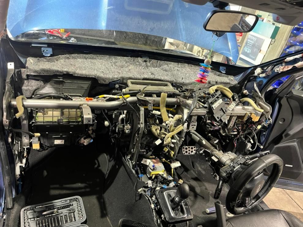 The Interior of a Car is Being Dismantled in a Garage — BA Auto Electrical In West Mackay, QLD