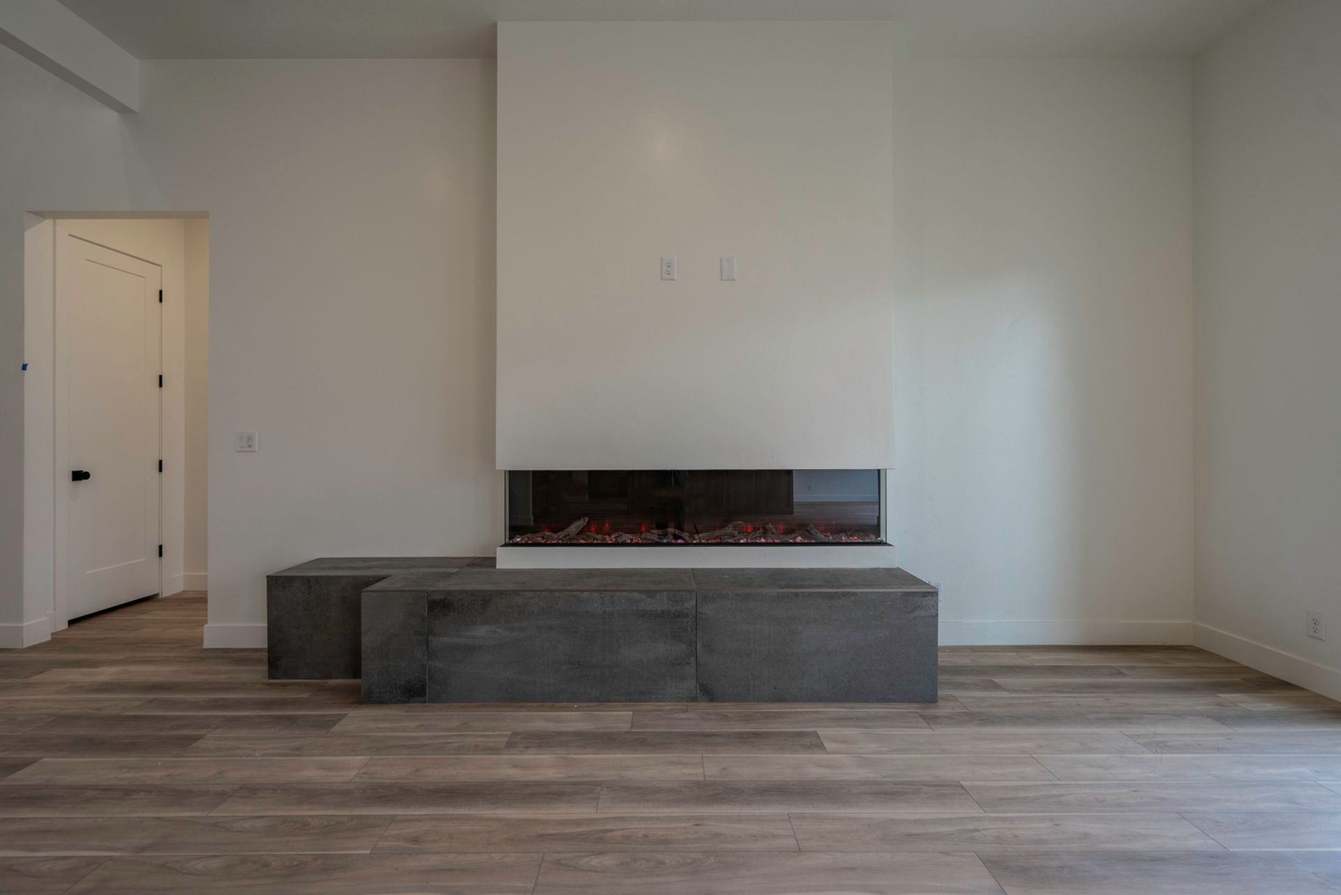 There is a fireplace in the middle of the room.