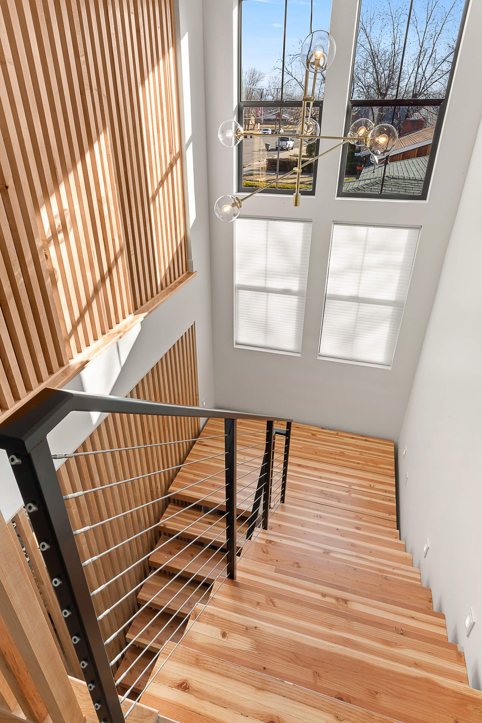 A wooden staircase leading up to the second floor of a house.