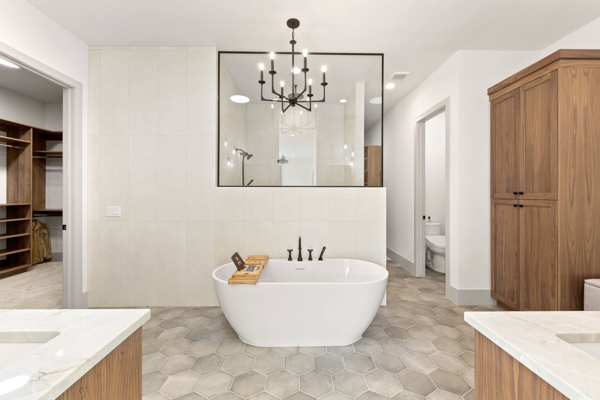 There is a bathtub in the middle of the bathroom.